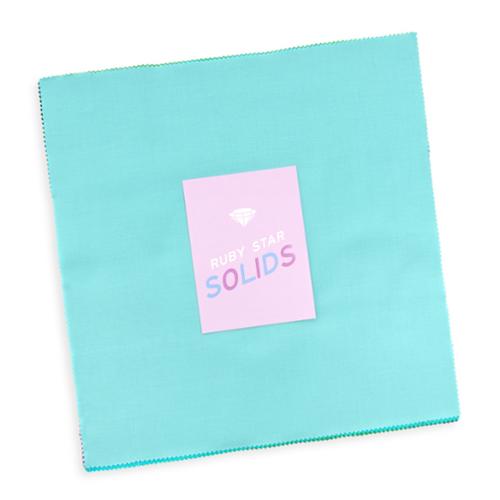 Ruby Star Solids Layer Cake of 10-inch solid fabric squares by Ruby Star Society for Moda